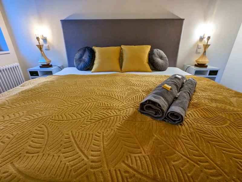 Welcoming bedroom with a king bed and mustard yellow bedding
